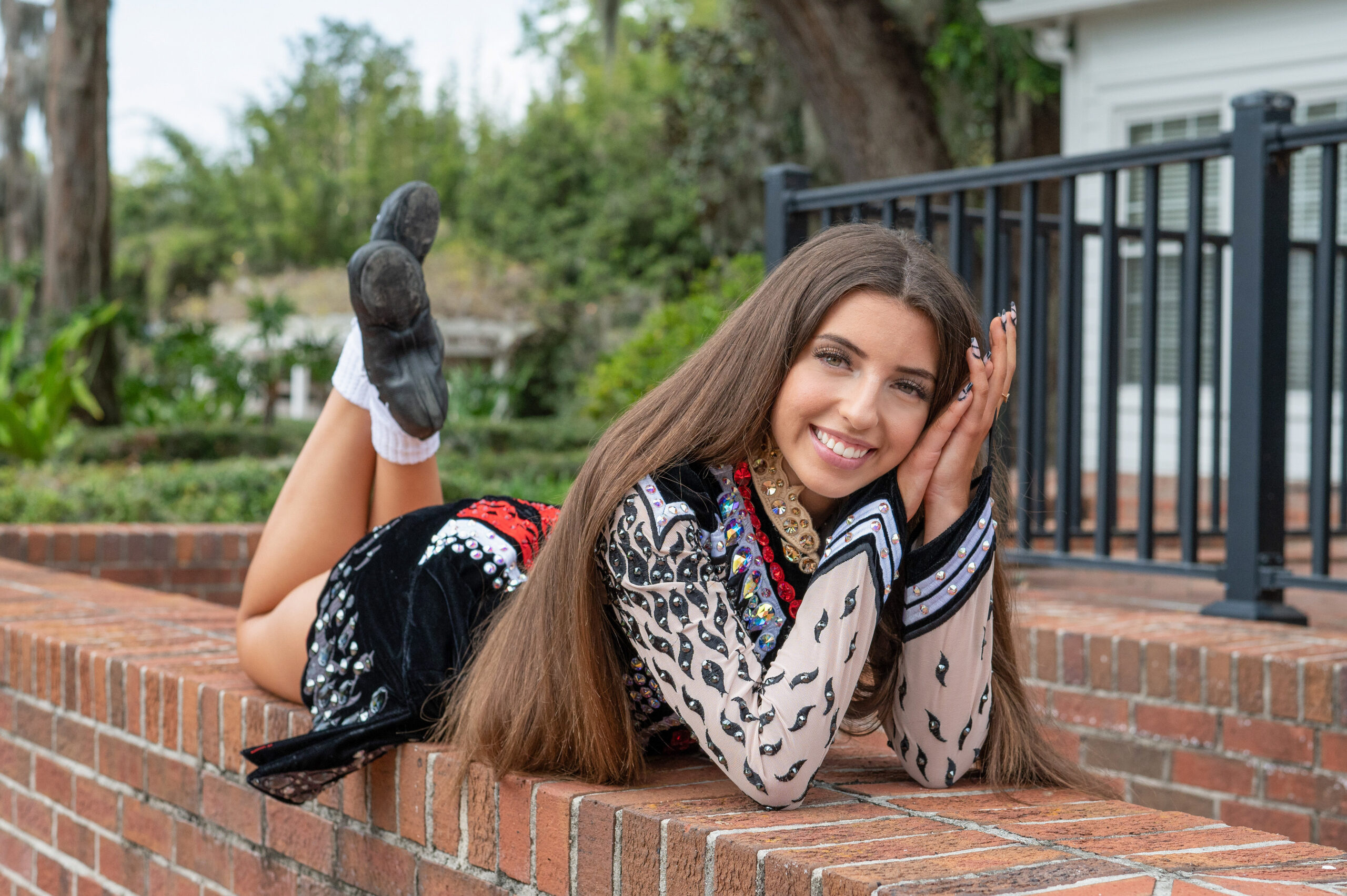 Orlando Senior Photographer photographing a senior girl from Oviedo High School who is wearing her competitive dance uniform.