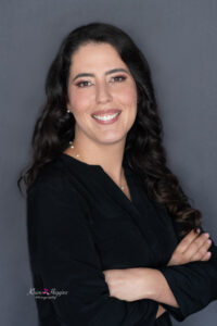 A woman smiling at khim higgins photography for her professional headshot in Orlando, Florida.