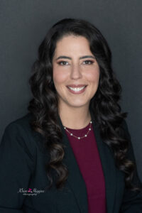 A woman is taking her professional headshots with Khim Higgins Photography in Oviedo, Florida.