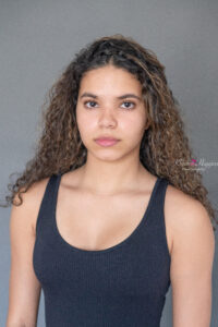 a pretty brunette girl doing a modeling headshot with khim higgins photography in oviedo, florida.