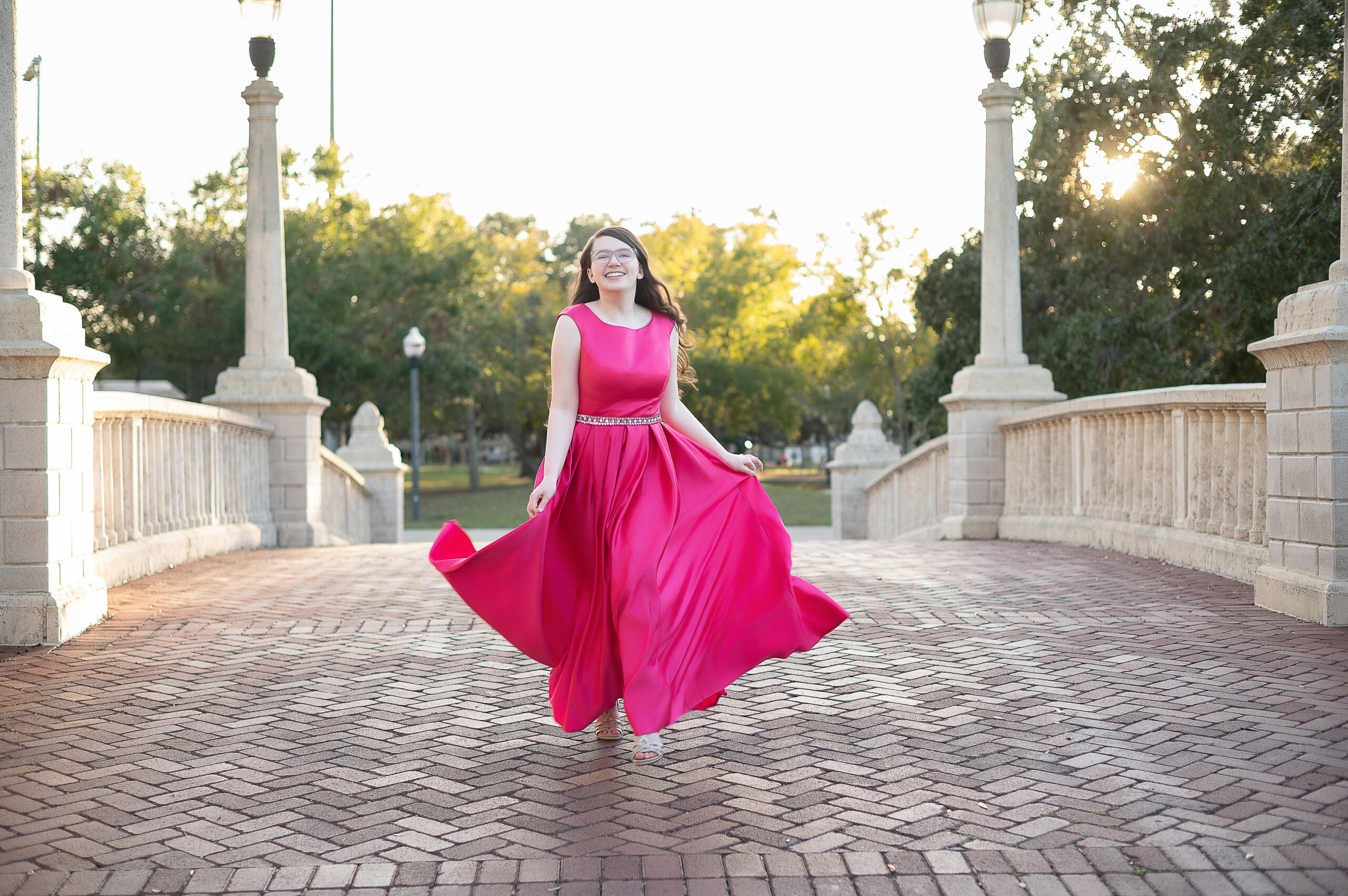 oviedo-senior-high-school-girl-in-formal-dress-running-towards-Khim-Higgins-Photography