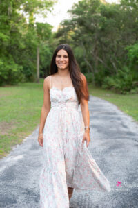 oviedo senior girl is having her photo taken at lake mills with khim higgins photography