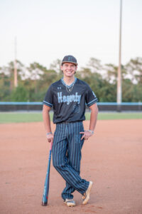 senior boy in his baseball uniform during his photo shoot