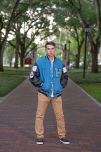 senior boy in letterman jacket in orlando