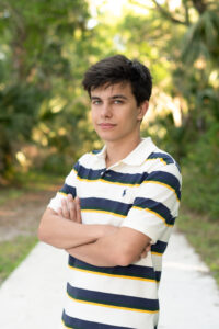 orlando senior boy standing in a park in orlando for his senior photo shoot.