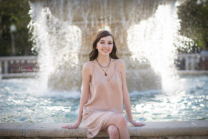 orlando senior girl sitting at a fountain