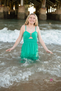 Senior girl smiling at sunrise on the beach, Orlando senior photographer
