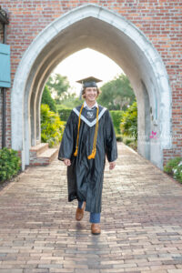 Senior boy portrait session in Orlando graduation cap and gown.