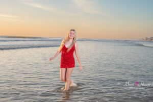 Senior girl walking along the beach at sunrise, beach senior portraits