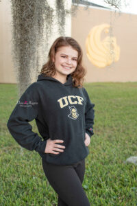Senior girl in a UCF college t-shirt