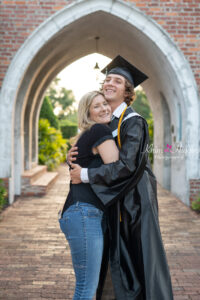 A Winter Park senior photographer capturing a special moment between a senior boy and his mom.