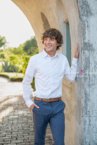Winter Park senior photographer photographing a senior boy at golden hour.