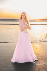 Senior girl standing at the beach at sunrise, Orlando beach senior photography