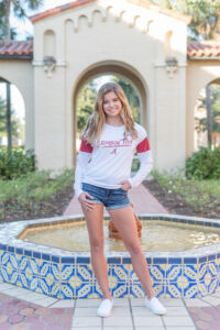 Senior girl in a college t-shirt and shorts