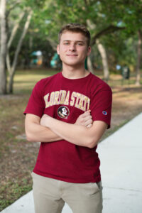 A senior boy in a FSU t-shirt