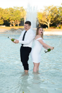 Orlando graduation photographer captures champagne celebration at UCF pond