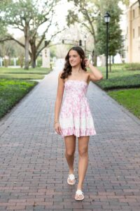 Oviedo senior girl in pretty pink dress smiling 
