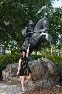 A ucf grad wearing a black dress