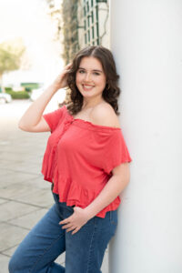 Timber Creek High School senior girl smiling during her senior photo shoot in Orlando, Florida