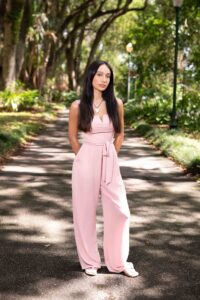 Orlando senior portrait outside under a canopy of trees at Leu Gardens.
