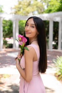 Orlando senior photo session with a senior girl holding her favorite flower, the tulips.