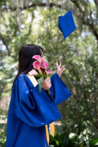 Orlando senior photo shoot with the cap tossed in the air.
